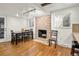 Dining area with hardwood floors and a stone fireplace at 6631 E Ithaca Pl, Denver, CO 80237