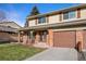 Two-story home with double front doors and attached garage at 6631 E Ithaca Pl, Denver, CO 80237