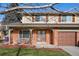 Brick home with double front doors and attached garage at 6631 E Ithaca Pl, Denver, CO 80237