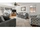 Bright living room with hardwood floors and comfy seating at 6631 E Ithaca Pl, Denver, CO 80237