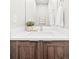 Modern bathroom vanity with wood cabinets and white countertop at 2828 N Federal Blvd, Denver, CO 80211