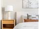 Stylish bedroom detail; nightstand with modern lamp at 2828 N Federal Blvd, Denver, CO 80211