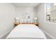 Cozy bedroom with a full bed and natural light at 2828 N Federal Blvd, Denver, CO 80211