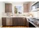 Modern kitchen with stainless steel appliances and wood cabinets at 2828 N Federal Blvd, Denver, CO 80211