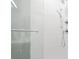 Modern shower with gray and white tile and glass door at 2828 N Federal Blvd, Denver, CO 80211