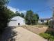 The property features a two-car garage, a shed, and nice trees at 475 Tennyson St, Denver, CO 80204