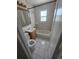 Traditional bathroom features a toilet, vanity, and shower-tub combo, with tiled floors and walls at 475 Tennyson St, Denver, CO 80204