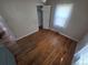 Bedroom featuring hardwood floors, closet, neutral walls, and a window at 475 Tennyson St, Denver, CO 80204