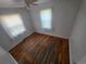 Bright bedroom featuring hardwood floors, two windows, and a ceiling fan at 475 Tennyson St, Denver, CO 80204