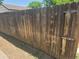 Close-up of a weathered wooden fence, ensuring privacy and defining the property boundary at 475 Tennyson St, Denver, CO 80204