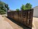 Backyard featuring a tall, dark-stained wooden fence and a gate at 475 Tennyson St, Denver, CO 80204
