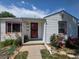 House with flowers, decorative rocks, and a pathway to the front door at 475 Tennyson St, Denver, CO 80204