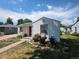 Home with a pathway, beautiful landscaping, and vibrant flowers at 475 Tennyson St, Denver, CO 80204