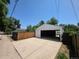 Detached garage with a concrete driveway at 475 Tennyson St, Denver, CO 80204