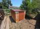 Metal shed in the backyard surrounded by trees and grass at 475 Tennyson St, Denver, CO 80204