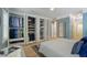 Bedroom features an organized walk-in closet with custom shelving and hanging rods to maximize storage space at 8721 E 23Rd Ave, Denver, CO 80238
