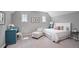 Cozy bedroom with a writing desk, chair and bright windows and a neutral color palette at 8721 E 23Rd Ave, Denver, CO 80238