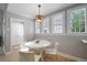 Bright breakfast nook with large windows and seating for four at 8721 E 23Rd Ave, Denver, CO 80238