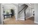 Entryway with hardwood floors, staircase, and office featuring a desk and chandelier at 8721 E 23Rd Ave, Denver, CO 80238