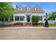 Attractive home with white exterior, black shutters, dormer windows, and a well-maintained front yard at 8721 E 23Rd Ave, Denver, CO 80238
