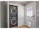Convenient laundry closet with stackable washer and dryer unit at 8721 E 23Rd Ave, Denver, CO 80238