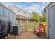 Outdoor patio area with a grill and a view of the fenced backyard with mature landscaping at 11923 E Ford Dr, Aurora, CO 80012