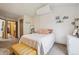 Inviting bedroom with natural light, soft bedding, and unique decorative accents at 11923 E Ford Dr, Aurora, CO 80012