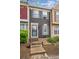 Charming townhome with blue shutters and a landscaped front, offering a welcoming entrance at 11923 E Ford Dr, Aurora, CO 80012