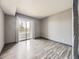 Empty bedroom with sliding door access to private balcony at 5745 W Atlantic Pl # 207, Lakewood, CO 80227