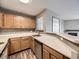 A well-lit kitchen featuring classic cabinets, and laminate countertops at 5745 W Atlantic Pl # 207, Lakewood, CO 80227