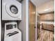 Compact, convenient laundry area featuring stacked washer and dryer, optimizing space in this cozy home at 5745 W Atlantic Pl # 207, Lakewood, CO 80227