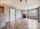 Living room with light grey walls, wood flooring, a fireplace, and natural light at 5745 W Atlantic Pl # 207, Lakewood, CO 80227