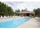 Community pool with lots of lounge seating around the building, perfect for warm, sunny days at 5745 W Atlantic Pl # 207, Lakewood, CO 80227