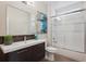 Bathroom with a single sink vanity, decorative blue vase and glass enclosed shower at 2122 S Ogden St, Denver, CO 80210