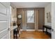 Cozy bedroom with hardwood floors, a desk, and natural light from a large window at 2122 S Ogden St, Denver, CO 80210