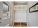 Mud room featuring storage with a bench, coat hooks and shelves for organization at 2122 S Ogden St, Denver, CO 80210