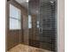 Tiled walk-in shower with glass door and stone tiled shower floor at 2122 S Ogden St, Denver, CO 80210