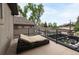 Private balcony with a lounge chair and black railing overlooking the neighborhood at 1927 S Grant St, Denver, CO 80210