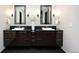 Modern bathroom featuring double vanity with dark cabinets, dual mirrors, and modern fixtures at 1927 S Grant St, Denver, CO 80210