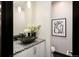 Stylish bathroom with a unique vessel sink, modern vanity, and decorative artwork at 1927 S Grant St, Denver, CO 80210