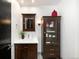 Bathroom featuring a wooden vanity with a white countertop, mirror, and a matching cabinet at 1927 S Grant St, Denver, CO 80210