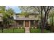 Charming two-story home with a well-maintained lawn and classic brick accents under a neutral toned facade at 1927 S Grant St, Denver, CO 80210