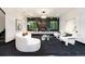Elegant living room with a fireplace, modern seating, and track lighting at 1927 S Grant St, Denver, CO 80210