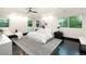 Spacious main bedroom with a tray ceiling, modern decor, and plenty of natural light at 1927 S Grant St, Denver, CO 80210