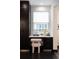 Functional office nook with a desk, drawers, and a comfortable chair, perfect for working from home at 1927 S Grant St, Denver, CO 80210