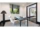 Well-lit office featuring a sleek desk, comfortable chair, and views of the outdoors at 1927 S Grant St, Denver, CO 80210