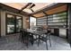Relaxing outdoor dining area with stainless steel appliances, ceiling fan, and large dining table at 1927 S Grant St, Denver, CO 80210