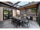 Stylish covered outdoor kitchen and dining area with a built-in grill, perfect for summer entertaining at 1927 S Grant St, Denver, CO 80210