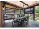Covered outdoor kitchen with ceiling fan, dining table, and stainless steel appliances at 1927 S Grant St, Denver, CO 80210