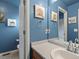Well-lit bathroom offering a single sink vanity, toilet, and tasteful nautical themed decorations at 12061 Ivy Way, Brighton, CO 80602